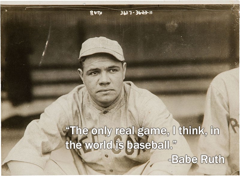 Babe Ruth sitting in the dugout during a game.